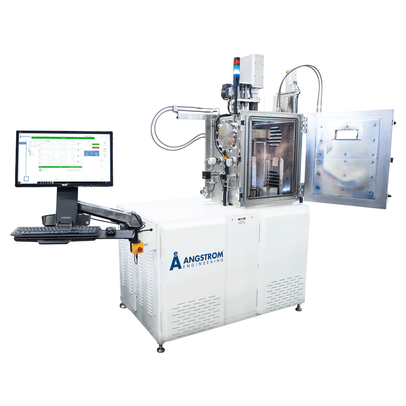 alt = The AMOD PVD physical vapour deposition platform from Angstrom Engineering, a compact white system with an open front chamber door revealing the internal water-cooled components. The Angstrom Engineering logo is largely displayed on the left side of the front of the unit. To the left side of the platform, a digital monitor and control panel Angstrom’s software called Aeres. The design highlights advanced technology, efficient cooling for sophisticated physical vapour deposition processes.